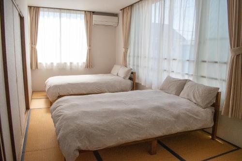 Postel nebo postele na pokoji v ubytování THE HORAI - Vacation STAY 73166v