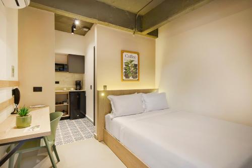 Ένα ή περισσότερα κρεβάτια σε δωμάτιο στο Hotel Attic 33