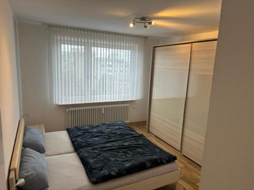 Ένα ή περισσότερα κρεβάτια σε δωμάτιο στο Kaiser-Rooms Dresdener Ring 3 6OG Nähe VW Werk