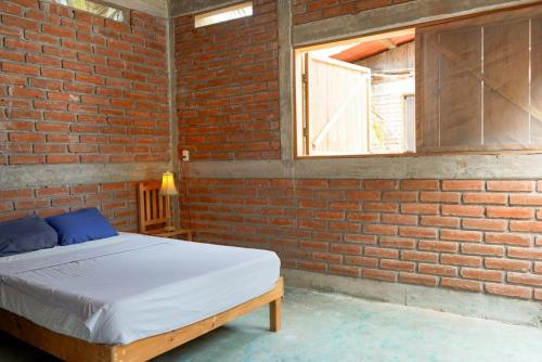 Postel nebo postele na pokoji v ubytování Wajakita Experience Hostel