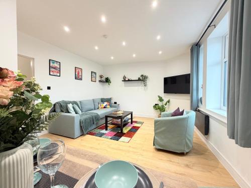 a living room with a couch and a table at Modern Apartment, Central Brighton Breakaway - Friends, Families, Work in Brighton & Hove