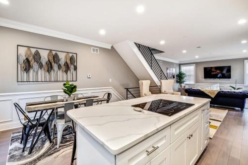a kitchen and living room with a table and chairs at Exceptional Downtown Townhome with Roof Deck -4Bedroom & 3Baths in Philadelphia