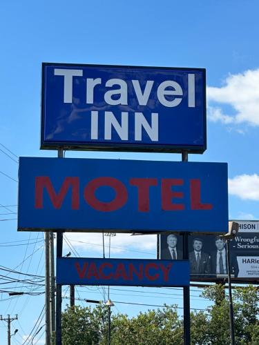 a sign for a travel inn motel at Travel Inn Montgomery AL in Montgomery