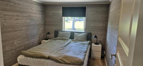 Ένα ή περισσότερα κρεβάτια σε δωμάτιο στο vänerstugan