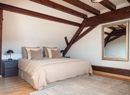 Ένα ή περισσότερα κρεβάτια σε δωμάτιο στο Résidence 90 m2 lumineuse - cour intérieure alsacienne, balcon & parking