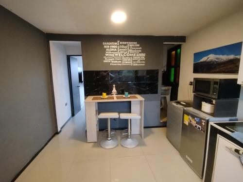 Kuchyň nebo kuchyňský kout v ubytování Hermoso Aparta-estudio Full equipado!