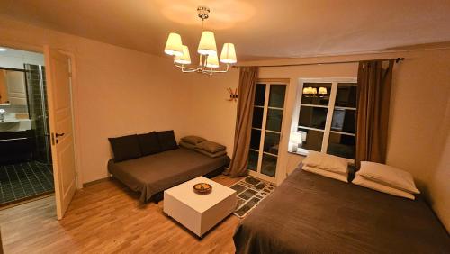 a living room with two beds and a couch at Studio Borgen in Sigtuna