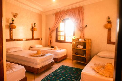 Ένα ή περισσότερα κρεβάτια σε δωμάτιο στο Surf Away Morocco