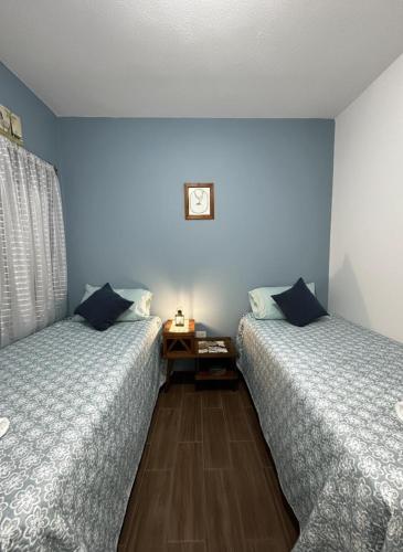 Ένα ή περισσότερα κρεβάτια σε δωμάτιο στο La Casa De Los Abuelos