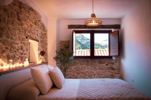 Postel nebo postele na pokoji v ubytování El Charcon Alojamiento Rural