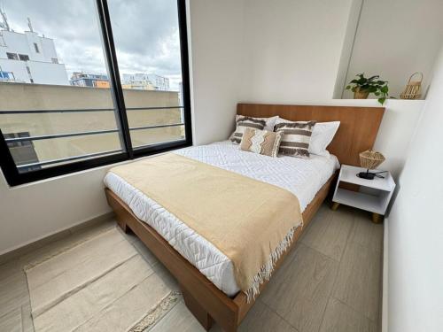 Ένα ή περισσότερα κρεβάτια σε δωμάτιο στο Spacious Apartment in the Laureles neighborhood