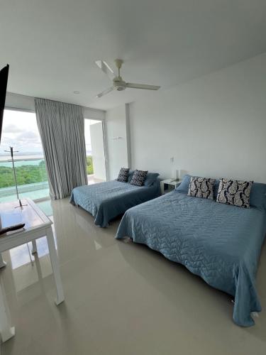 Postel nebo postele na pokoji v ubytování Morros 922 Seaside Retreat