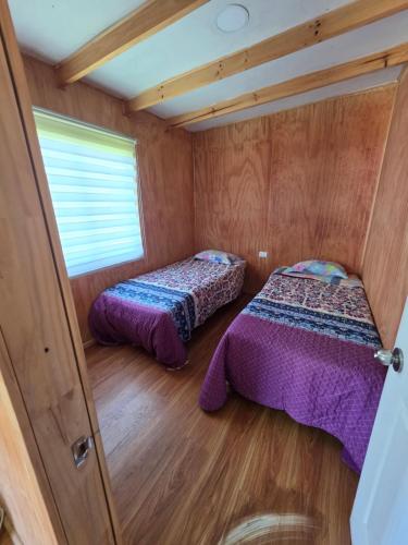 Postel nebo postele na pokoji v ubytování Cabaña Playa Chauquen 2