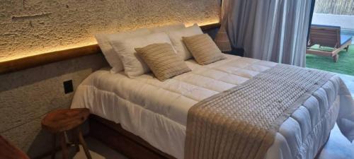 Ένα ή περισσότερα κρεβάτια σε δωμάτιο στο Casa de Luxo na praia - São Miguel dos Milagres