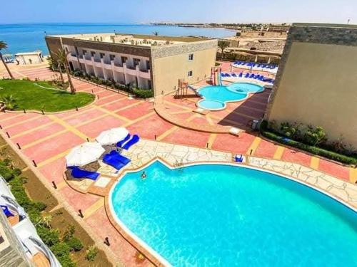 an overhead view of a swimming pool at a resort at cecelia resort in Hurghada