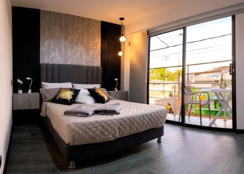 Postel nebo postele na pokoji v ubytování Apartment suite Encanto de Caldas