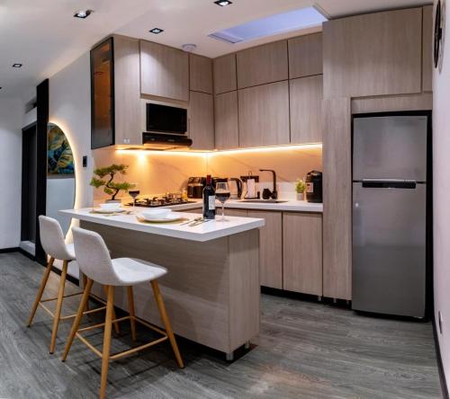 Kuchyň nebo kuchyňský kout v ubytování Apartment suite Encanto de Caldas