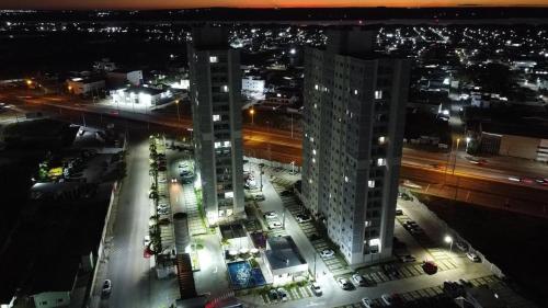 an aerial view of a city at night at (208)Apt de luxo com varanda 2 quartos 1km do Mar in Tambauzinho