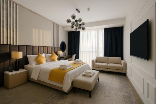 a bedroom with a large bed and a living room at Deluxe Marina View 2BR - Stella Maris Retreat in Dubai