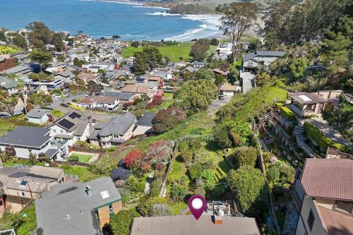 an aerial view of a town with houses and the ocean at Small Home with Ocean View walk to Restaurants Brewery Shops Beach in Pacifica