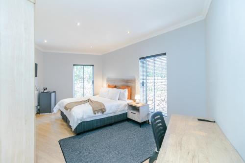 Ένα ή περισσότερα κρεβάτια σε δωμάτιο στο Peace Haven Sandton