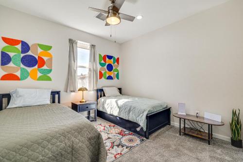 a bedroom with two beds and a ceiling fan at Hike and Ski! Home with Dog-Friendly Yard in Eagar in Eagar