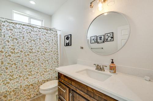 a bathroom with a sink and a toilet and a mirror at Hike and Ski! Home with Dog-Friendly Yard in Eagar in Eagar