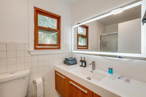 a bathroom with a sink and a mirror at Updated Getaway with Sauna and Yard in Bloomsbury! in Port Warren