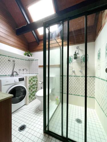 a bathroom with a shower and a toilet in it at The Loft in South West Rocks