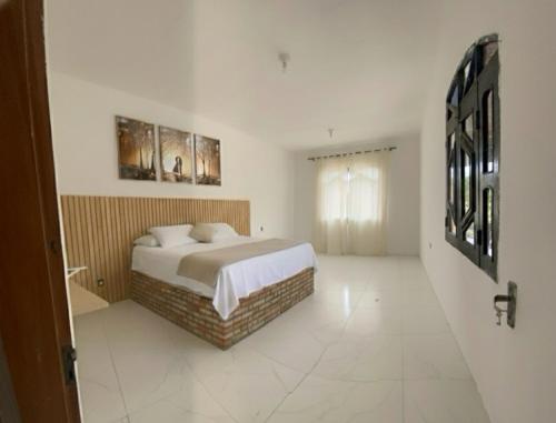 Postel nebo postele na pokoji v ubytování Quarto com bela vista