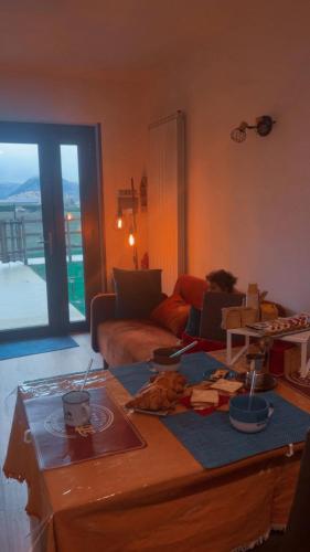 a living room with a couch and a coffee table at Jamari Sangro House in Castel di Sangro