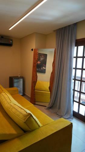 a bedroom with two beds and a window at Loft Jeri Premium in Jericoacoara