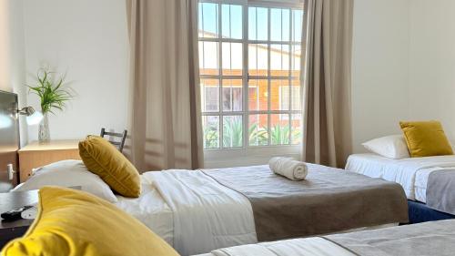 Postel nebo postele na pokoji v ubytování G7 Confortable Monoambiente Triple con Cochera