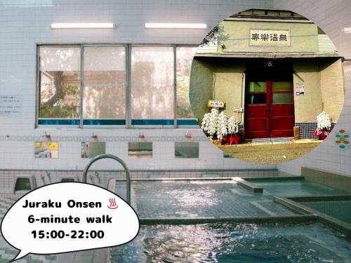 a swimming pool in a building with a mirror at Takoyaki Time Osaka in Osaka