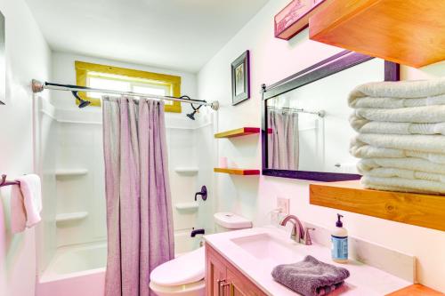 a bathroom with a sink and a toilet and a mirror at 12 Mi to Bozeman Pet-Friendly Gem with Sauna and Yard in Belgrade