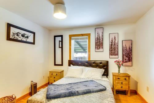 a bedroom with a large bed and a window at 12 Mi to Bozeman Pet-Friendly Gem with Sauna and Yard in Belgrade