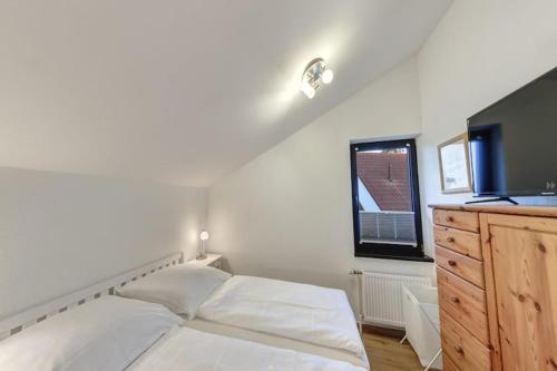 Ένα ή περισσότερα κρεβάτια σε δωμάτιο στο Ferienwohnung in Burhave