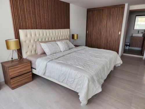 En eller flere senge i et værelse på 15 Súper Loft con Aire Acondicionado, Consulado