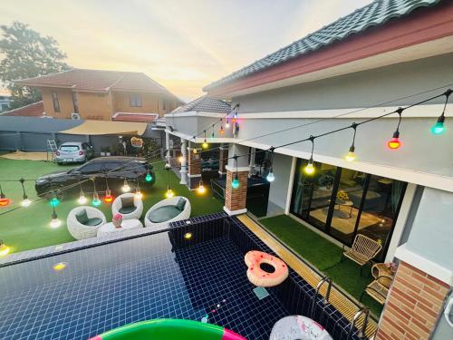 a balcony of a house with a swimming pool at Kate Pool Villa Jomtien Pattaya in Pattaya
