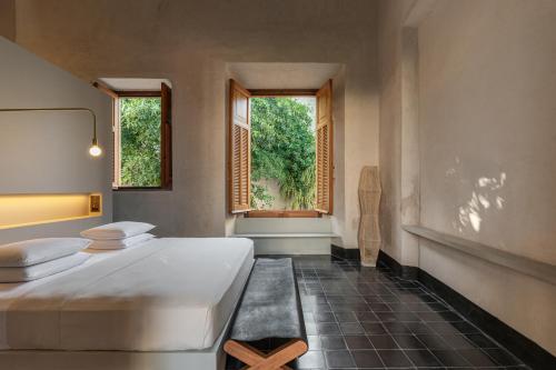 Ένα ή περισσότερα κρεβάτια σε δωμάτιο στο Hotel Sevilla