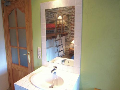 a bathroom with a sink and a mirror at Apartment near Forest and Hiking Trails in Treignes