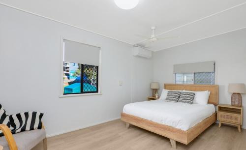 Ένα ή περισσότερα κρεβάτια σε δωμάτιο στο Reel Paradise on Ocean