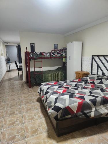 a bedroom with two bunk beds in a room at la pipi in Las Heras