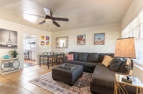 a living room with a couch and a ceiling fan at *Free Parking near Strip Cozy 2Br home Side: A in Las Vegas