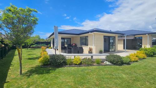 a house with a garden in front of it at 10 @ Wai Matangi in Turangi
