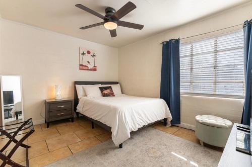 a bedroom with a bed and a ceiling fan at *Free Parking near Strip Cozy 2Br home Side: A in Las Vegas