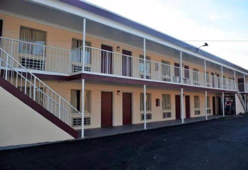 a building with balconies on the side of it at Fort Eustis INN in Newport News