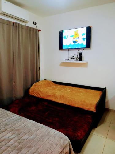 Postel nebo postele na pokoji v ubytování Bonaires V departamento monoambiente cerca de la costanera