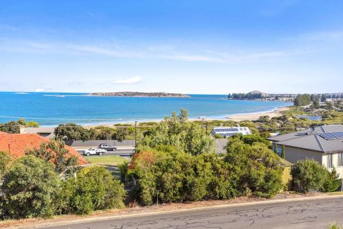a view of the ocean from a house at 13 The Crescent - BYO Linen - Ocean Views - Wi-Fi in McCracken