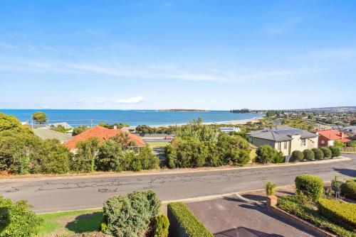 an aerial view of a street with houses and the ocean at 13 The Crescent - BYO Linen - Ocean Views - Wi-Fi in McCracken